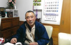 やさしい表情でランチュウを語る冨永さん